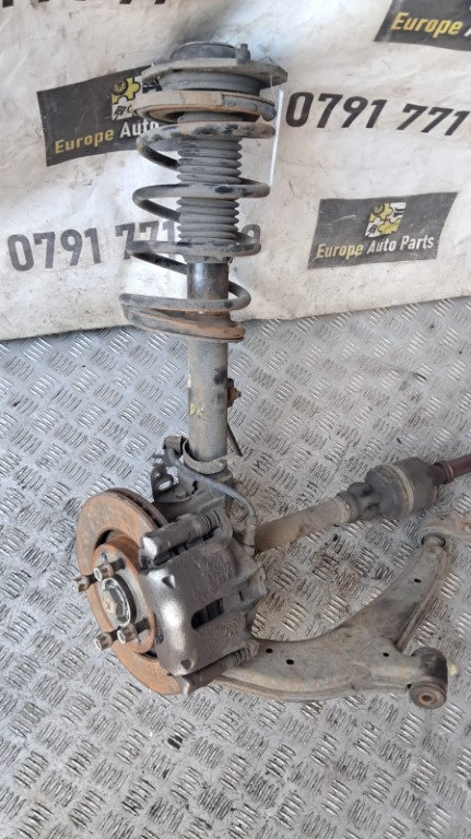 Amortizor cu arc dreapta fata Peugeot Partner 2.0 HDI cod motor RHY , transimie manuala an 2004