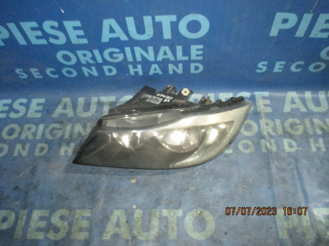 Far BMW E90 2005; 6942723 (volan dreapta, urechi rupte)