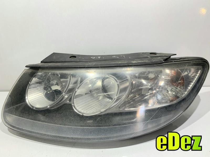 Far stanga cu lupa Hyundai Santa Fe 2 (2006-2012)