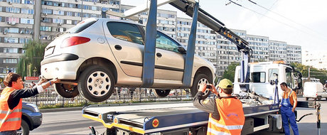 Hingherii auto se intorc! Masinile parcate ilegal ar putea fi din nou ridicate si soferii pusi la plata