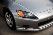 Honda S2000 cu 1.464 km la bord