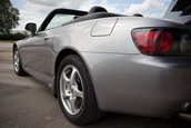Honda S2000 cu 1.464 km la bord