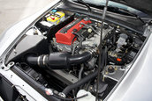 Honda S2000 cu 1.464 km la bord