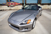 Honda S2000 cu 1.464 km la bord