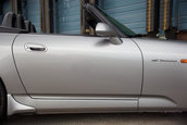 Honda S2000 cu 1.464 km la bord