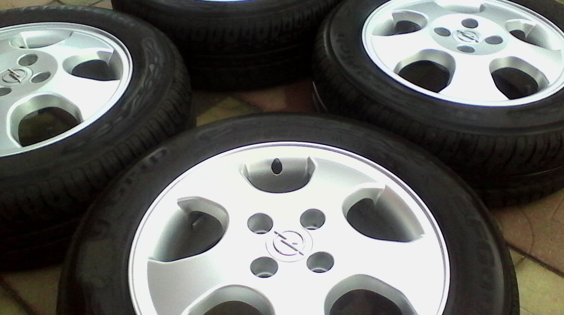 JANTE ALIAJ DE 15 INCH 4X100 PT OPEL ORIGINALE MODEL DEOSEBIT