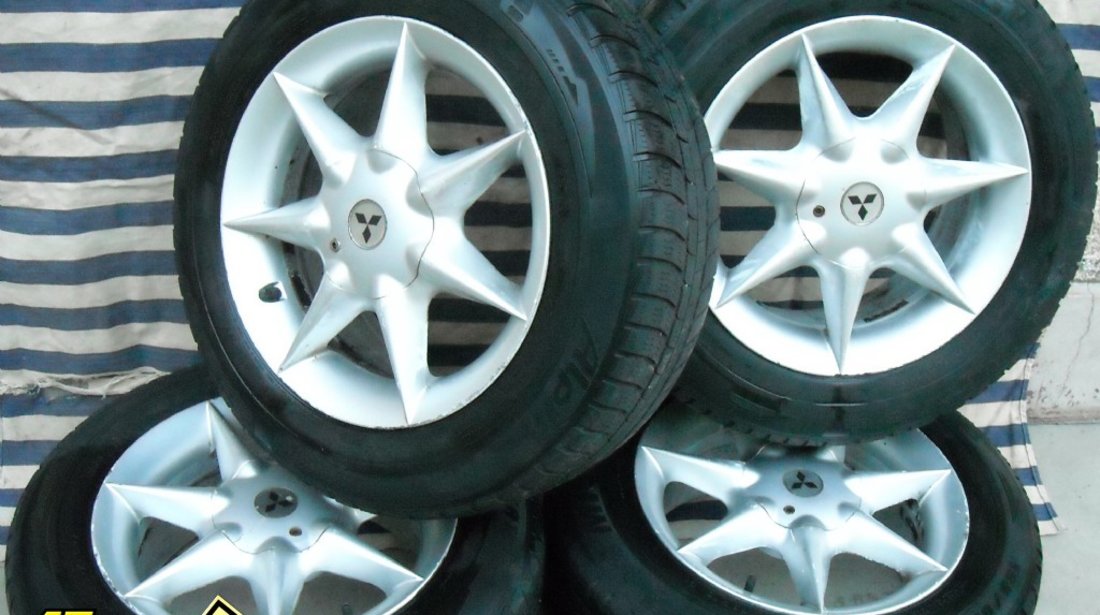 JANTE aliaj pe 15 originale MITSUBISHI cu anvelope iarna MICHELIN Neg