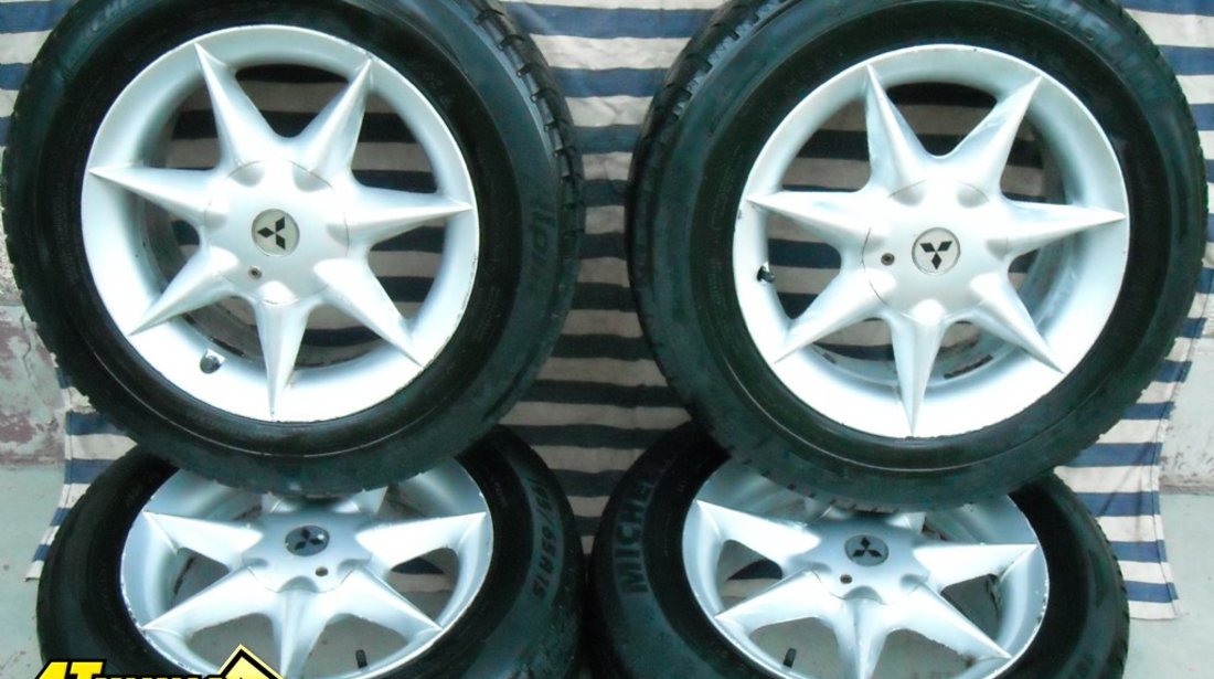 JANTE aliaj pe 15 originale MITSUBISHI cu anvelope iarna MICHELIN Neg