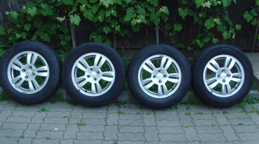 Jante de aliaj ca Noi 4x100 pe 15 originale Chevrolet Aveo T300 din2012+anvelope vara 195/65R15