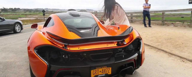 O fatuca se chinuie cu portiera unui McLaren P1