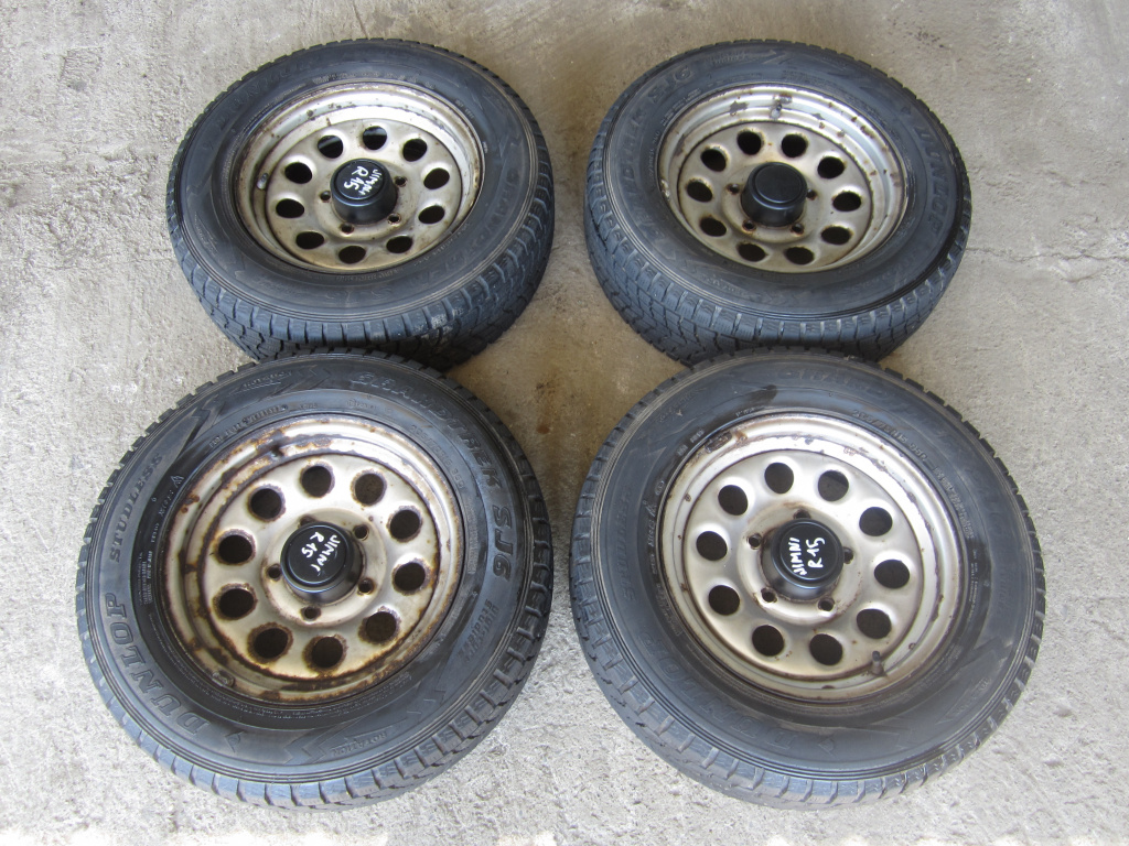 SET 4 JANTE TABLA R15 CU ANVELOPE DUNLOP M+S SUZUKI JIMNY FAB. 1998 - 2009 ⭐⭐⭐⭐⭐