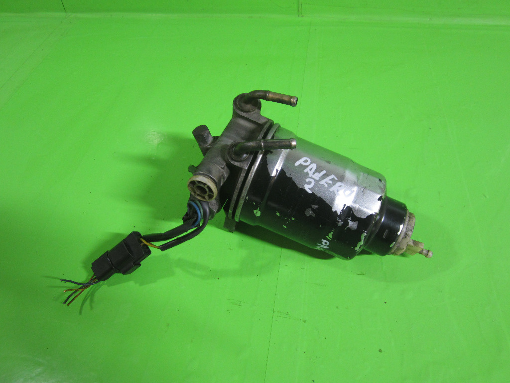 SUPORT / CARCASA FILTRU MOTORINA / COMBUSTIBIL MITSUBISHI PAJERO 2 4x4 2.8 TD FAB. 1991 - 1999 ⭐⭐⭐⭐⭐