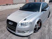Click image for larger version

Name:	eurp_0712_13_z+2005_audi_a4_2.0t_quattro+abt_front_spoiler_oe_phantom_black_grill_creative_autow.jpg
Views:	61
Size:	79.3 KB
ID:	1217759