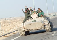 Click image for larger version

Name:	Iraqi_military_men_riding_on_tank.jpg
Views:	76
Size:	287.2 KB
ID:	1205802