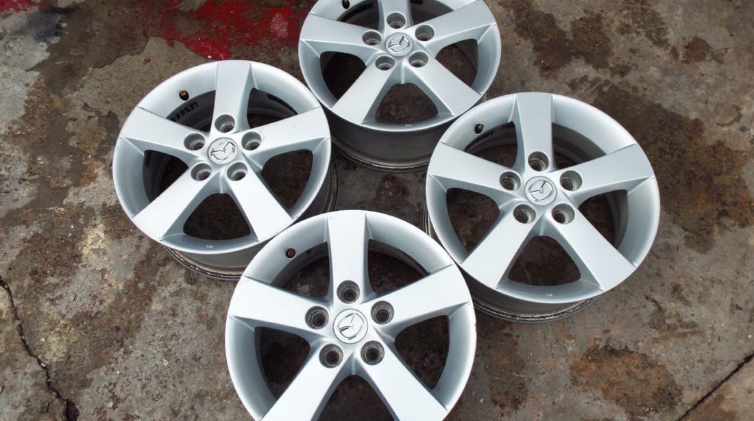 vand 4 jante de aliaj pe 15" originale mazda 3,5 pret 900ron toate4